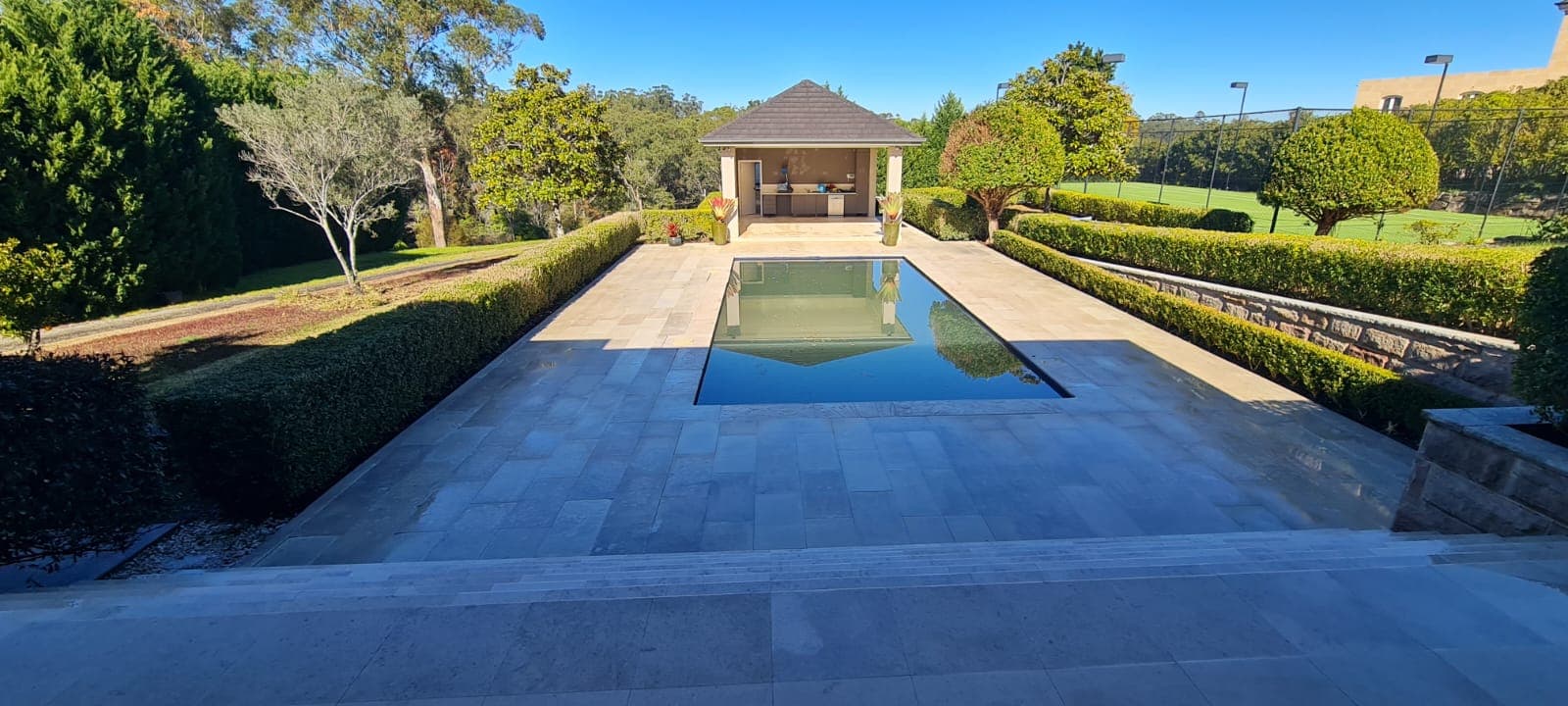 Pool surround completed in spray-on concrete